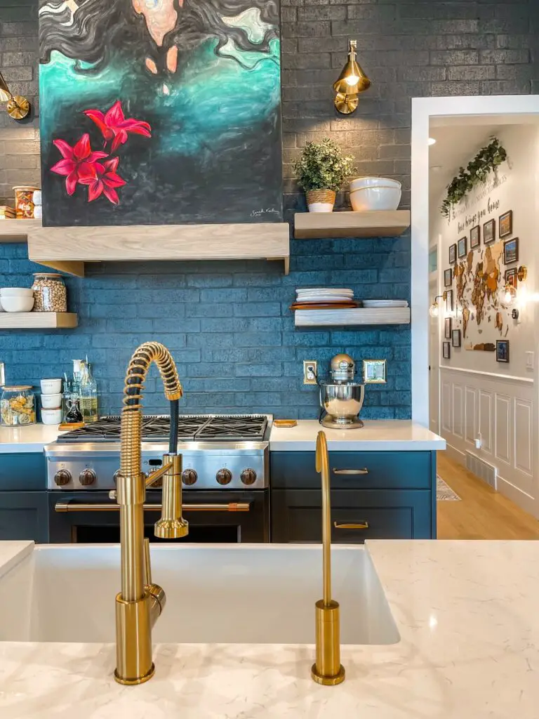 Navy kitchen with exposed brick
