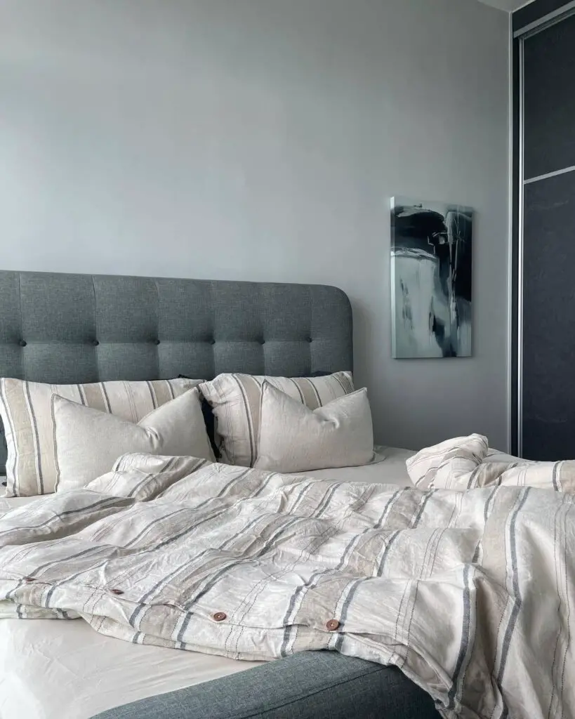 Minimalist bedroom with grey bed