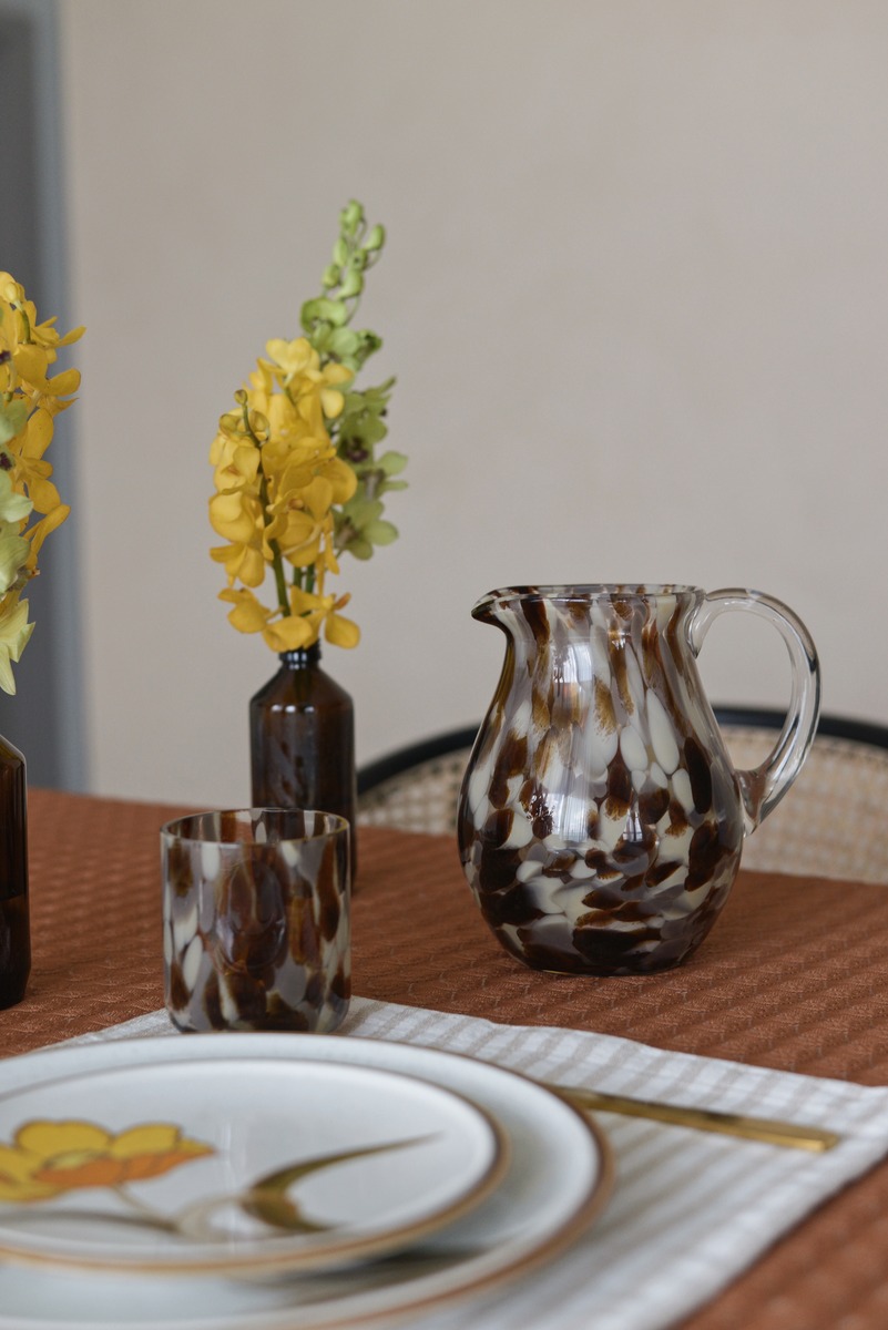 Tortoiseshell water jug and drinking glasses