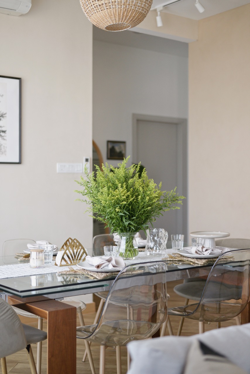 Transparent acrylic chairs with glass dining table
